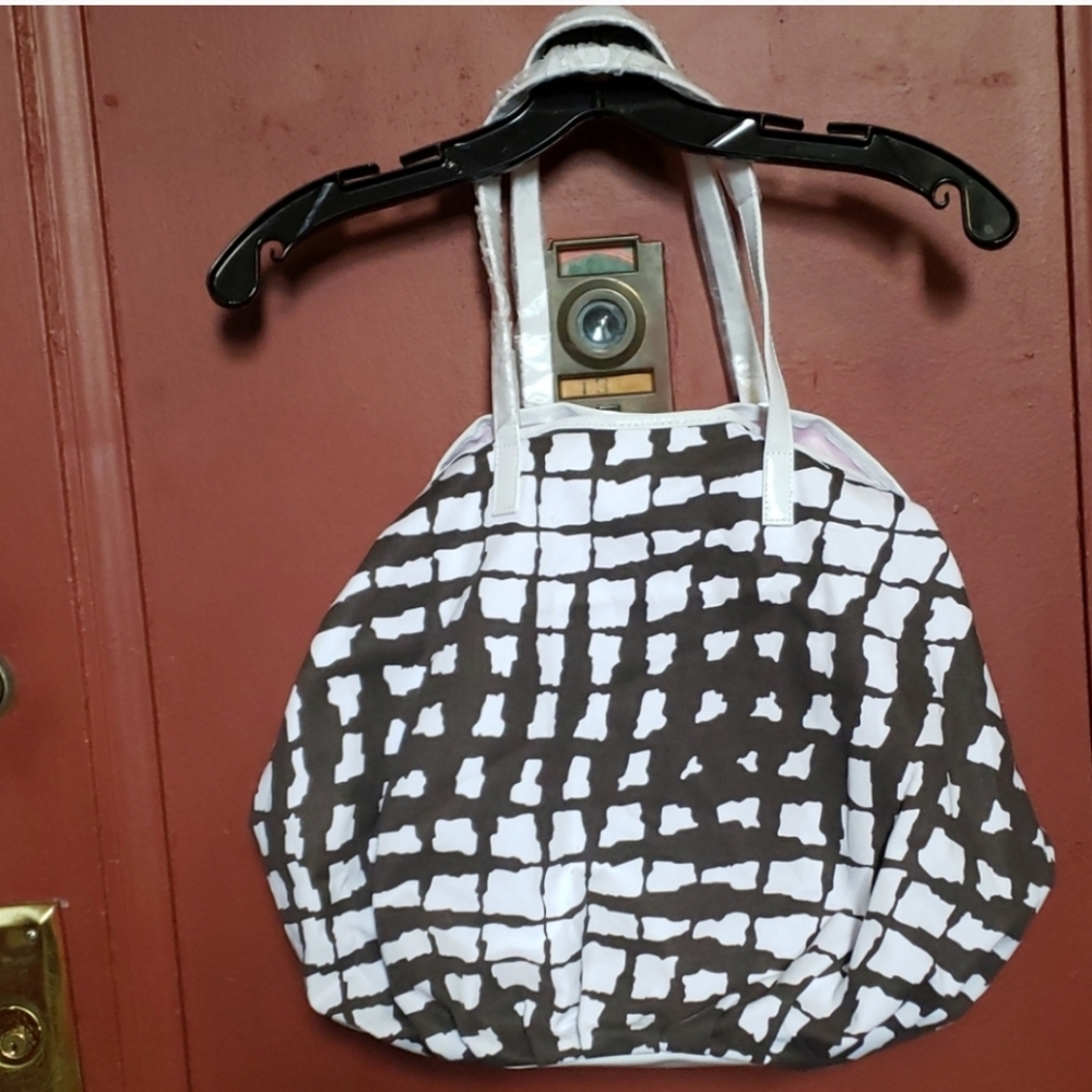 SAX FITH AVE  TOTE BROWN AND WHITE BAG WITH LAVENDER LINING